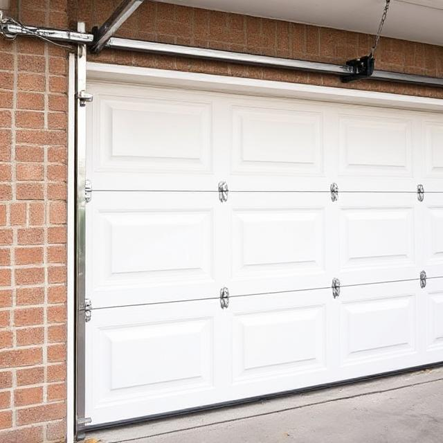 Garage Door Panel Alignment & Balance Check | Express Garage Door Los Angeles Garage door panel alignment and balance check performed in Los Angeles. The image shows level tools being used to ensure precise alignment between panels for smooth garage door operation.