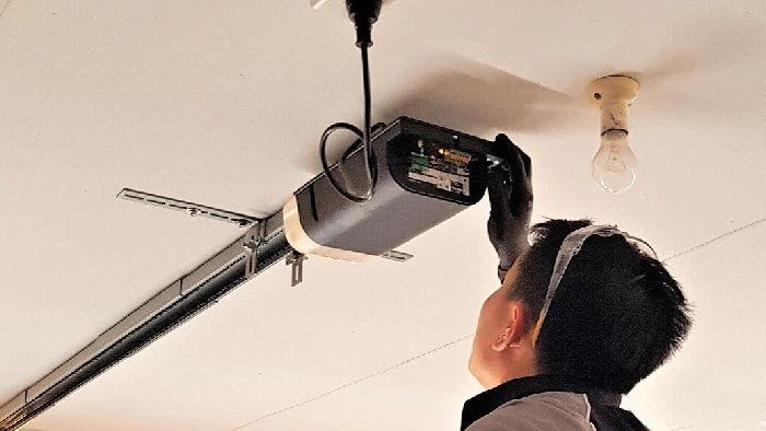 Garage Door Opener Repair in Culver City – Local Technician On the Job Technician repairing garage door opener motor in Culver City CA garage